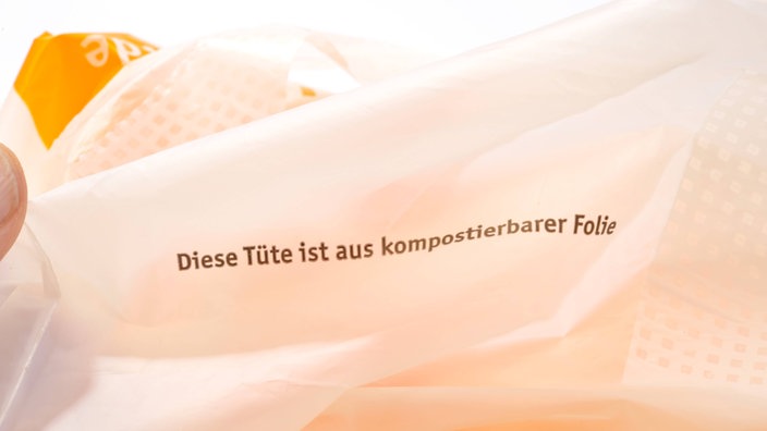 Tüte mit Aufschrift "Diese Tüte ist aus kompostierbarer Folie"